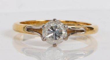 An 18 carat gold and diamond solitaire ring, the single round brilliant cut diamond at 0.68ct
