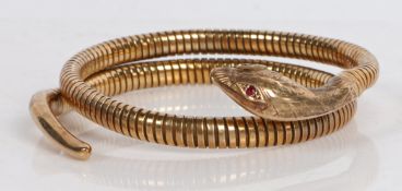 A 9 carat gold and steel spring snake bracelet by Smith & Pepper, the acanthus leaf engraved head