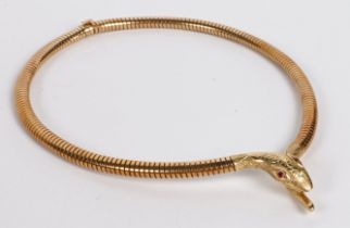 A 9 carat gold snake necklace, the acanthus leaf engraved head with garnet set eyes, 35g