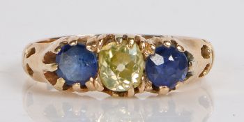 A yellow metal, diamond and sapphire ring, the head set with a central round cut diamond flanked