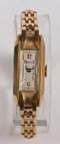 A Rolex 9 carat gold ladies wristwatch, the white rectangular dial with Arabic numerals, the