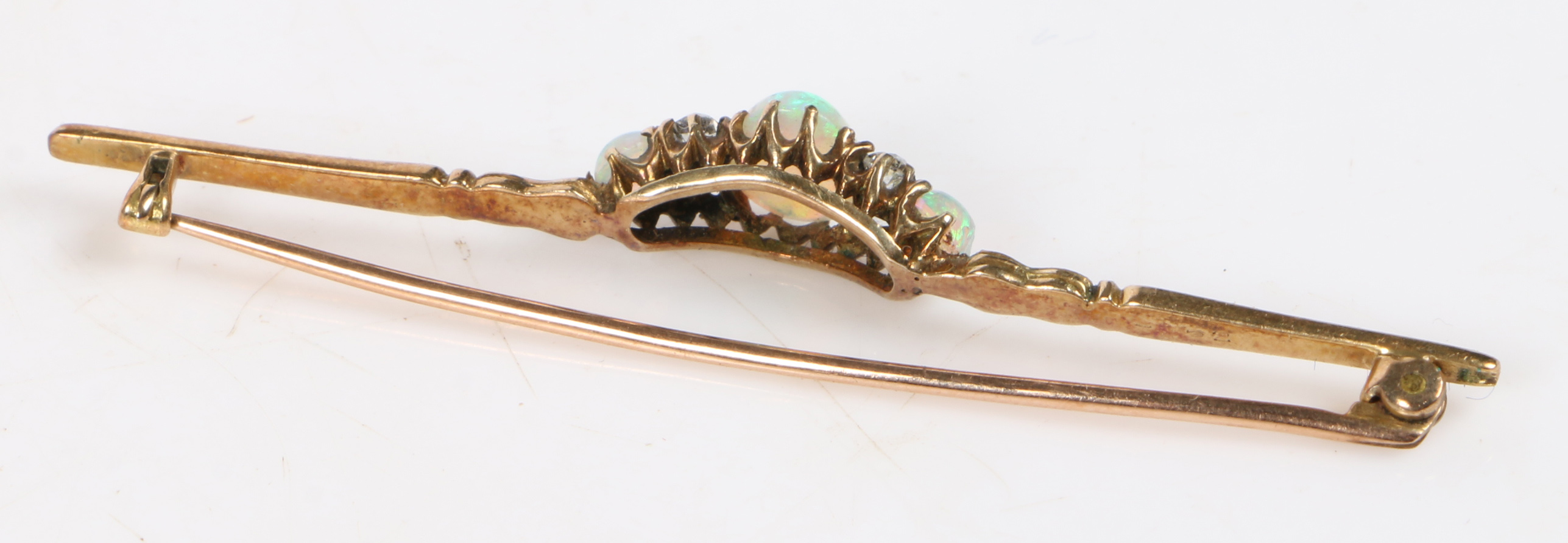 An 18 carat gold bar brooch set with a central oval opal flanked by four diamonds and a further - Bild 6 aus 6