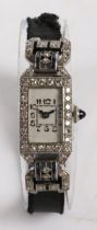 An Art Deco platinum, diamond and sapphire cocktail watch, the white dial with Arabic numerals,