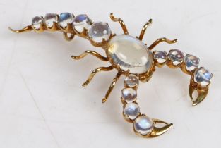 A moonstone set scorpion brooch, with cabochon cut moonstones to the body, tail and claws, 44.7mm