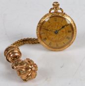 A continental 18 carat gold open face pocket watch, the gilt dial with foliate central boss and