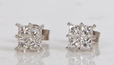 A pair of 18 carat white gold and diamond set ear studs, of square form each set with four square