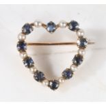 A yellow metal, sapphire and pearl heart form brooch, the pierced heart form brooch bordered with