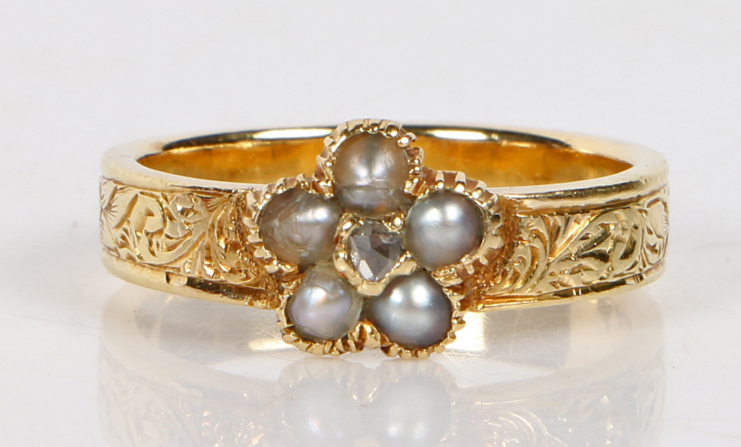 A 19th Century diamond, pearl and yellow metal mourning ring, the central rose cut diamond