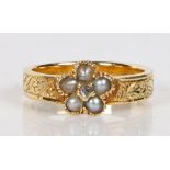 A 19th Century diamond, pearl and yellow metal mourning ring, the central rose cut diamond