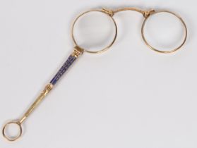 A pair of gilt and blue enamel lorgnettes, the tapering blue enamel handle with release catch to the