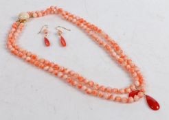 A coral bead necklace and pair of earrings, the necklace formed from two strands of circular beads