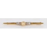 An 18 carat gold bar brooch, set with a central pearl flanked by four diamonds, 51mm wide, 4.1g