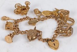A 9 carat gold charm bracelet, with heart form clasp and twelve 9 carat gold charms to include