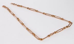 A 9 carat gold pocket watch chain, formed from oval links, with a clip to each end, 57cm long, 50g