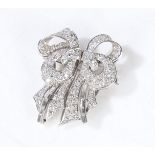 A diamond set double clip brooch, each clip set with brilliant and baguette cut diamonds, with