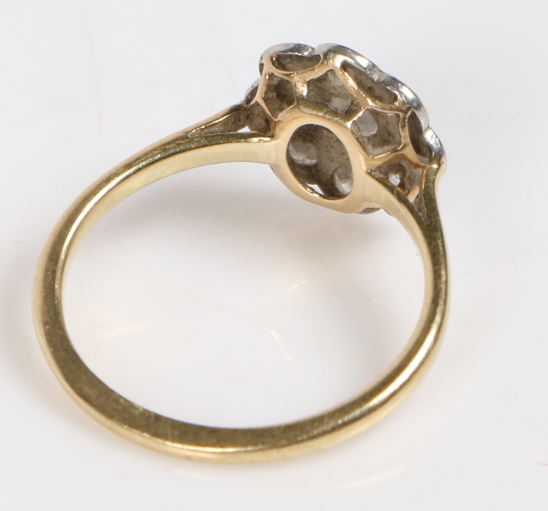 A yellow metal, platinum and diamond ring, the head set with a central round diamond surrounded by a - Bild 2 aus 2