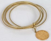 A 14 carat gold bangle formed from seven beaded and rope twist bands, connected by a single collar