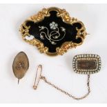 A Victorian yellow metal, black enamel and pearl mourning brooch, the pearl set foliate centre on