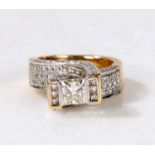 An 18 carat gold and diamond ring, the head set with a central princess cut diamond estimated at 0.