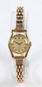 A Rolex 18 carat gold ladies wristwatch, the signed dial with star and triangular markers, manual