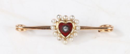 A 15 carat gold bar brooch, the central red and white enamelled heart with diamond to the centre