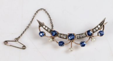 An Edwardian sapphire, diamond and pearl brooch, of crescent form with three sapphires