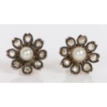 A pair of rose cut diamond and pearl earrings, of flower head form, the central pearls with eight