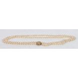 A cultured pearl single strand necklace with 9 carat gold and pearl set clasp, 126cm long