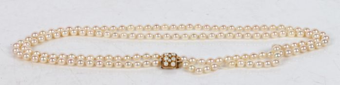 A cultured pearl single strand necklace with 9 carat gold and pearl set clasp, 126cm long
