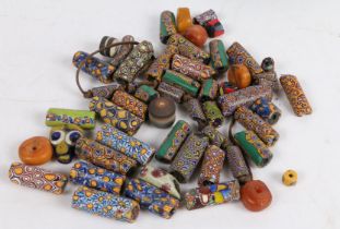 A collection of Venetian glass African trade beads, the polychrome millefiori cane beads of