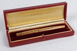 A Parker 18 carat gold fountain pen, the engine turned lid and body with rectangular cartouche