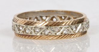 A 9 carat gold and diamond full eternity ring, the central white gold band set with round cut