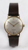 A Marvin 18 carat gold gentleman's wristwatch, the signed silver dial with baton markers,