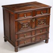 A Charles II oak geometric chest of drawers, of small proportions, the rectangular top above four