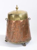 A 19th Century Dutch copper and brass peat pail, the brass lid above a tapering body embossed with