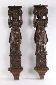 Two 17th century carved columns, each depicting a lady holding aloft an ionic capital above