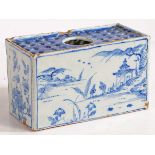 An 18th Century Delft flower brick, with Oriental landscape decorated front and back flanked by