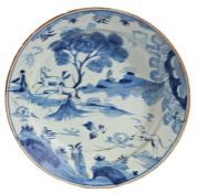 An 18th Century delft charger, the central field decorated with a stag and doe pursued by a hound,