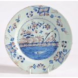 An 18th Century Delft plate, Bristol circa 1750, the central filed decorated with a landscape