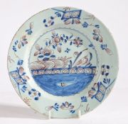 An 18th Century Delft plate, Bristol circa 1750, the central filed decorated with a landscape