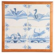 A set of four 18th Century delft tiles, depicting a rabbit, a dragonfly and two ducks, housed in a