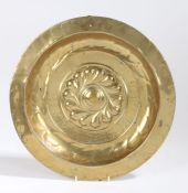 A 17th Century brass alms dish, Nuremberg, the centre embossed with fourteen repeating gadroons,