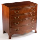 A Regency style mahogany and boxwood strung bow front chest, the boxwood inlaid bow top above a