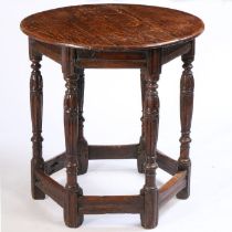 An oak centre table, the associated top from a 17th Century drop leaf table above Elizabethan
