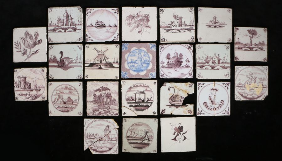 A collection of twenty-two 18th Century and later delft tiles, to include manganese and blue and