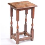 An 18th Century and later table, the later rectangular top above long turned supports united by