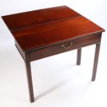 A George III mahogany tea table, the rectangular top above square section legs with canted edge,