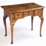 A George III fruitwood lowboy, the rectangular top above three short drawers and slender cabriole