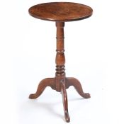 A George III oak occasional table, of small proportions, the circular top above a turned column