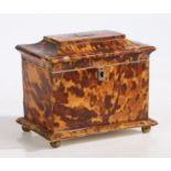 A Regency tortoiseshell tea caddy, the swept lid with rectangular cartouche engraved with a lion